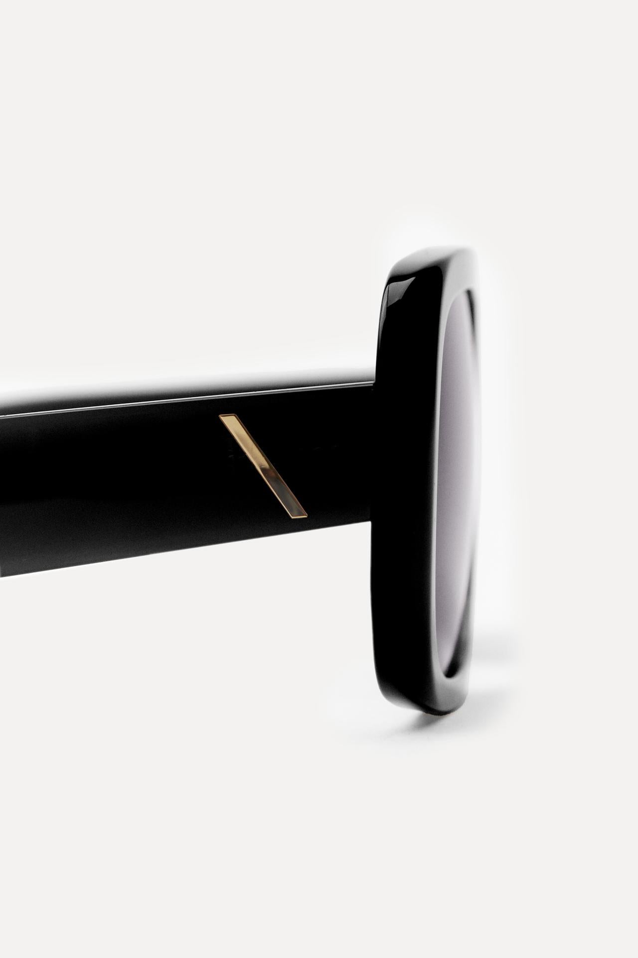 OCCHIALI DA SOLE CON SCUDO DEL 50° ANNIVERSARIO